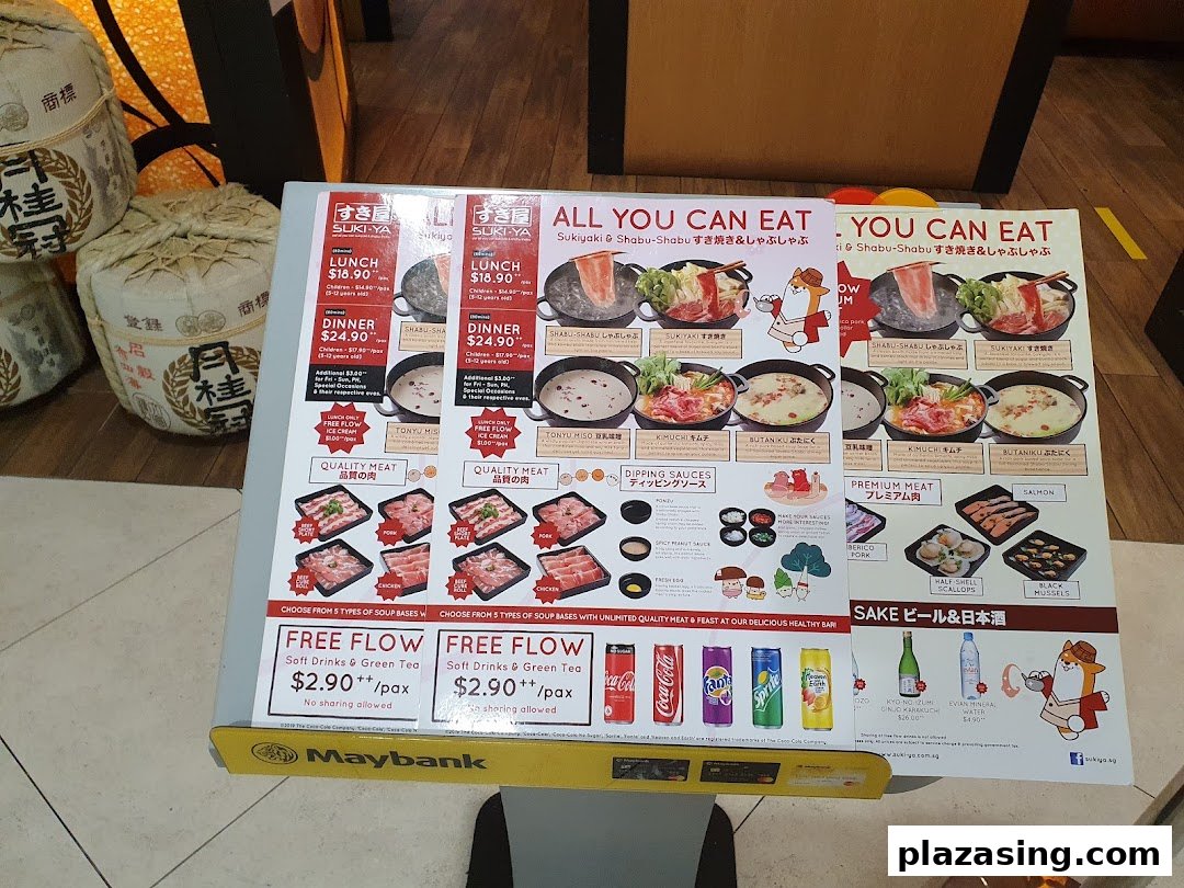 A detailed menu board for SUKI-YA, showcasing all-you-can-eat hotpot options, meats, and drinks.