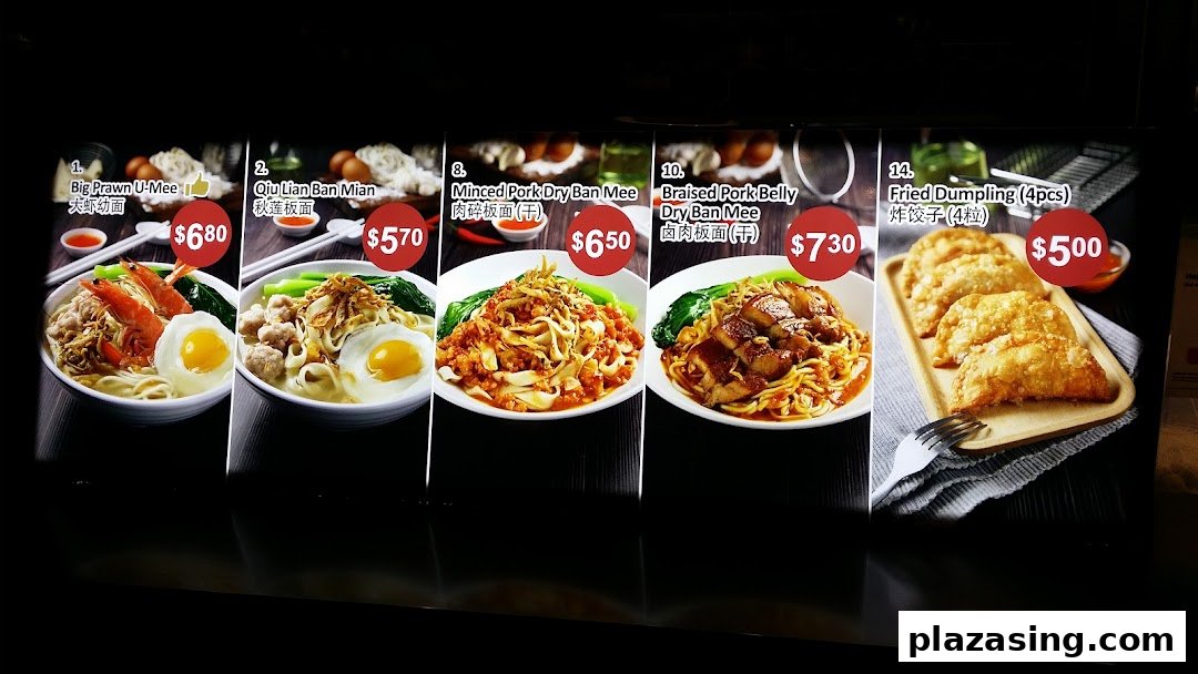 A vibrant menu display showcasing various noodle dishes and fried dumplings with prices.
