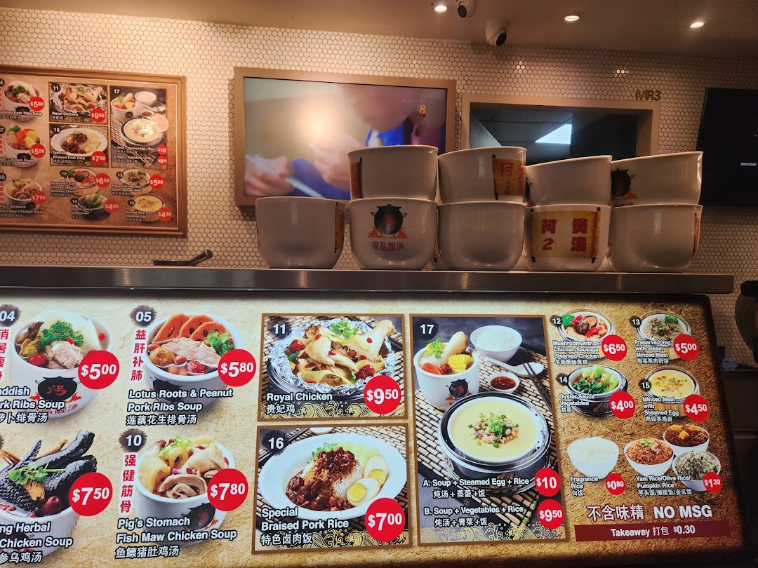A vibrant menu board showcasing a variety of traditional Chinese soups and dishes with prices.