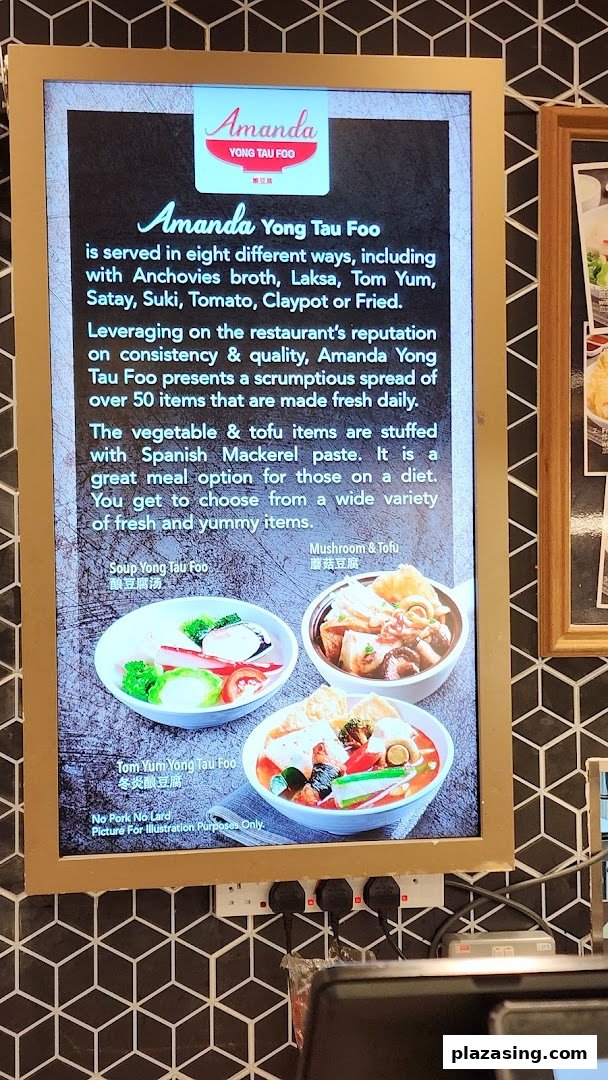 A digital menu board showcasing Amanda Yong Tau Foo's offerings with various broth options and fresh ingredients.