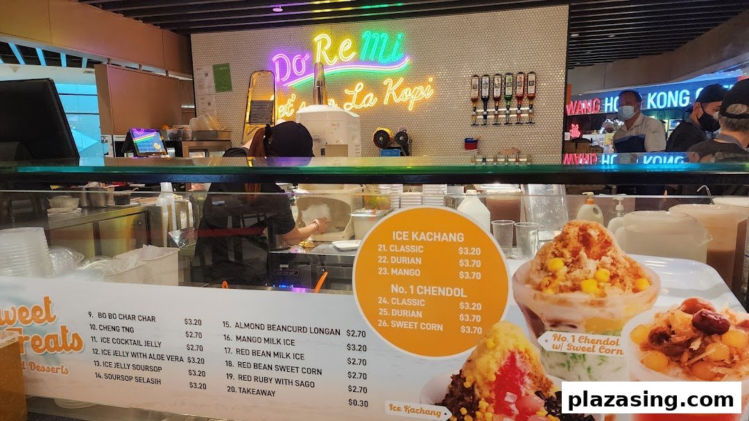 A food stall counter displaying a menu for traditional Asian desserts like Ice Kachang and Chendol.