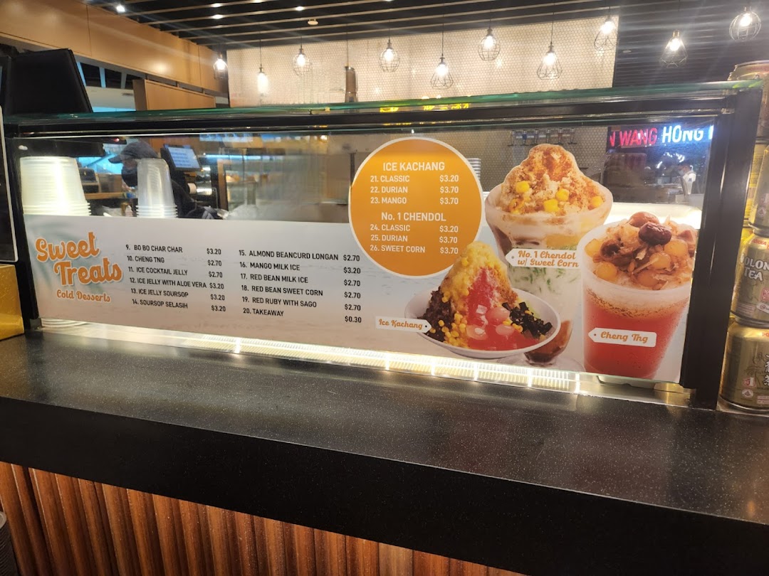 A display counter showcasing a variety of refreshing Asian cold desserts and their prices.