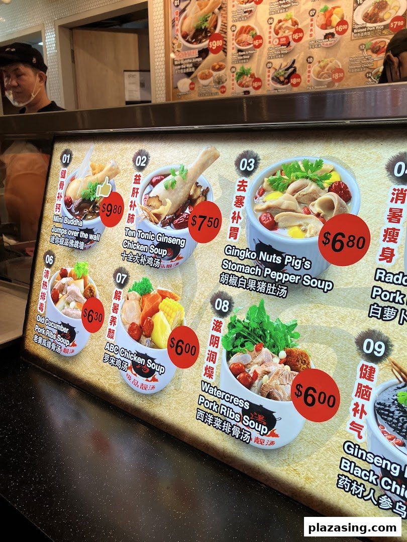 A brightly lit menu board displaying various traditional Chinese soups with prices and descriptions.