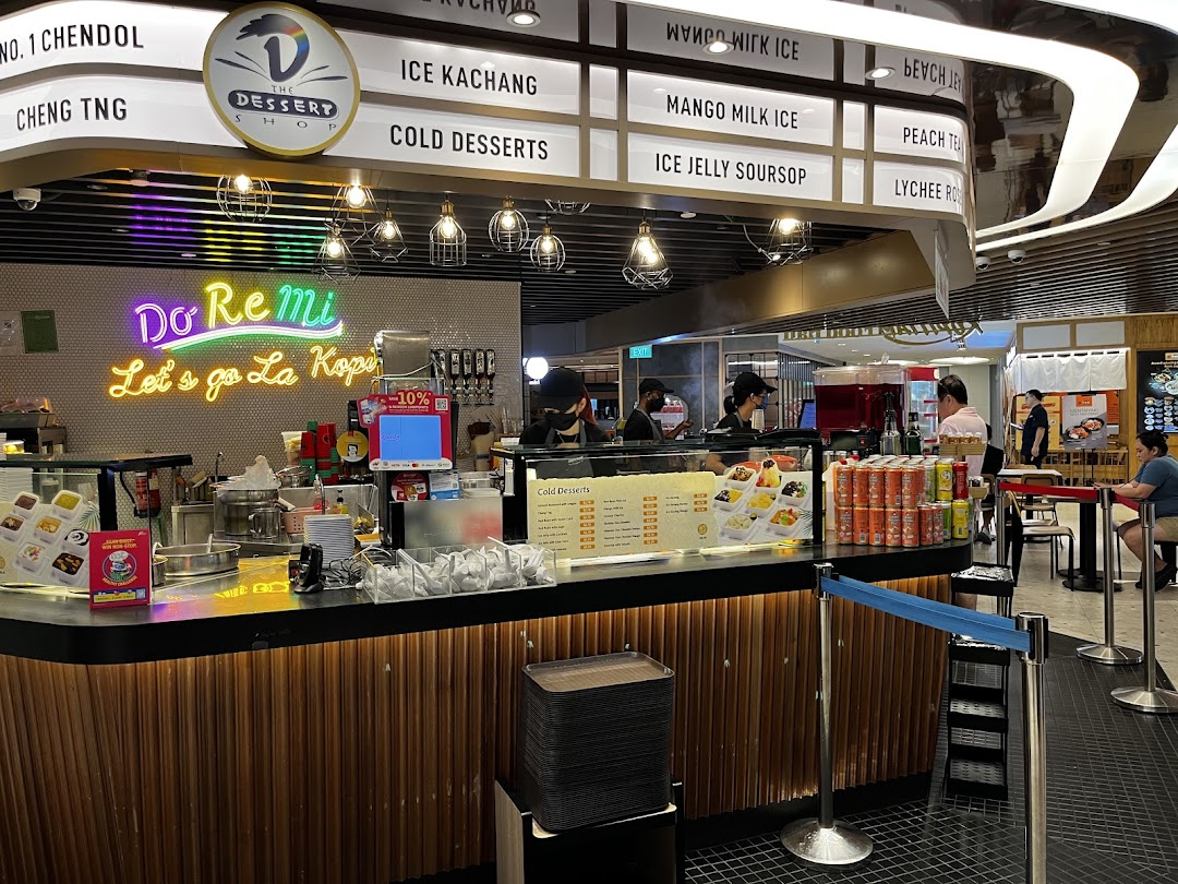 A vibrant dessert stall named Do Re Mi The Dessert Shop, showcasing its menu and cold treats.