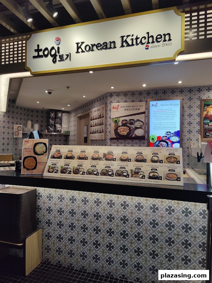 Interior view of ToGi Korean Kitchen stall within Kopitiam Food Hall, featuring menu displays and counter.
