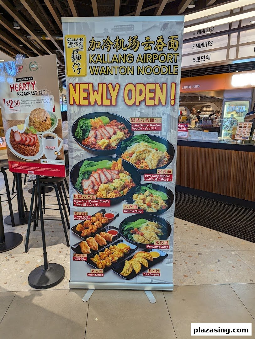 Promotional banners showcasing wanton noodles, dumplings, and a breakfast set at Kopitiam Food Hall.
