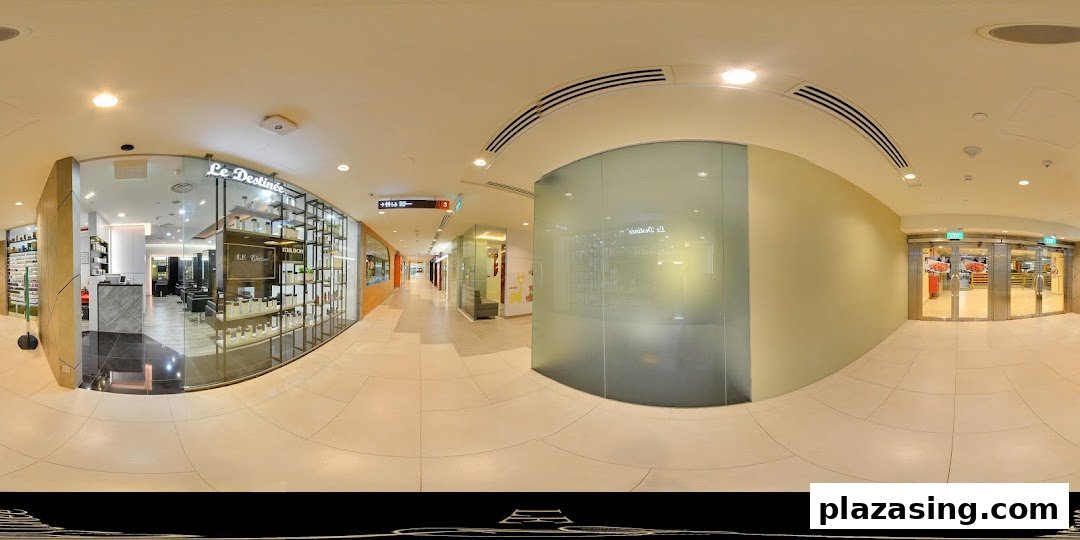 The inviting glass entrance of Le Destinee hair salon, showcasing product displays and a modern interior.