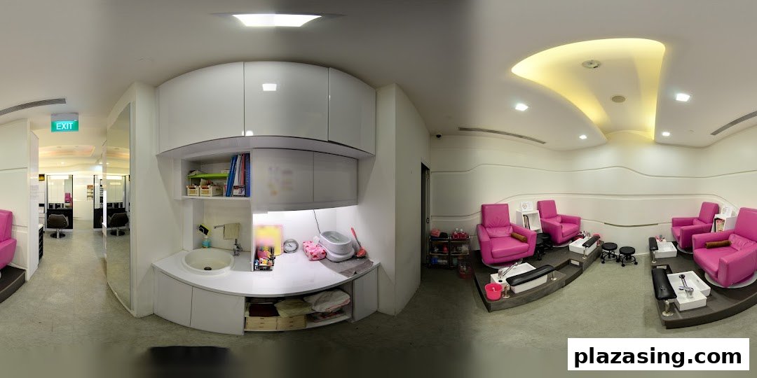 A modern salon interior featuring vibrant pink pedicure chairs and a hair styling section.