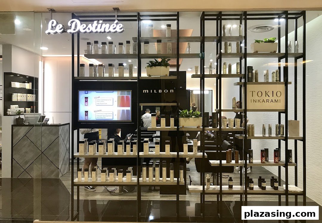 The shop front of Le Destinee, a hair salon, showcasing products and its modern interior.