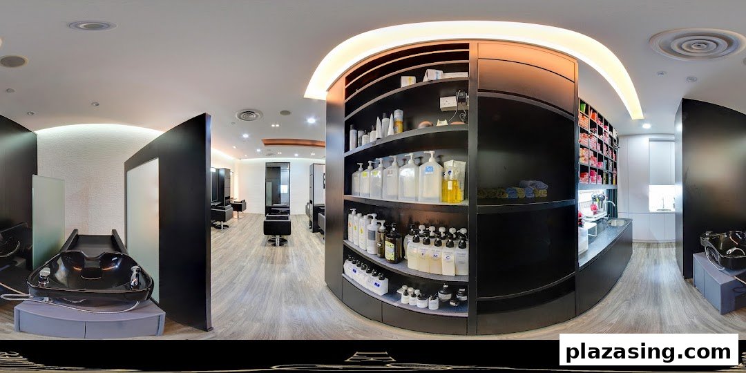 A panoramic view of a modern hair salon interior with styling stations, wash basins, and product displays.