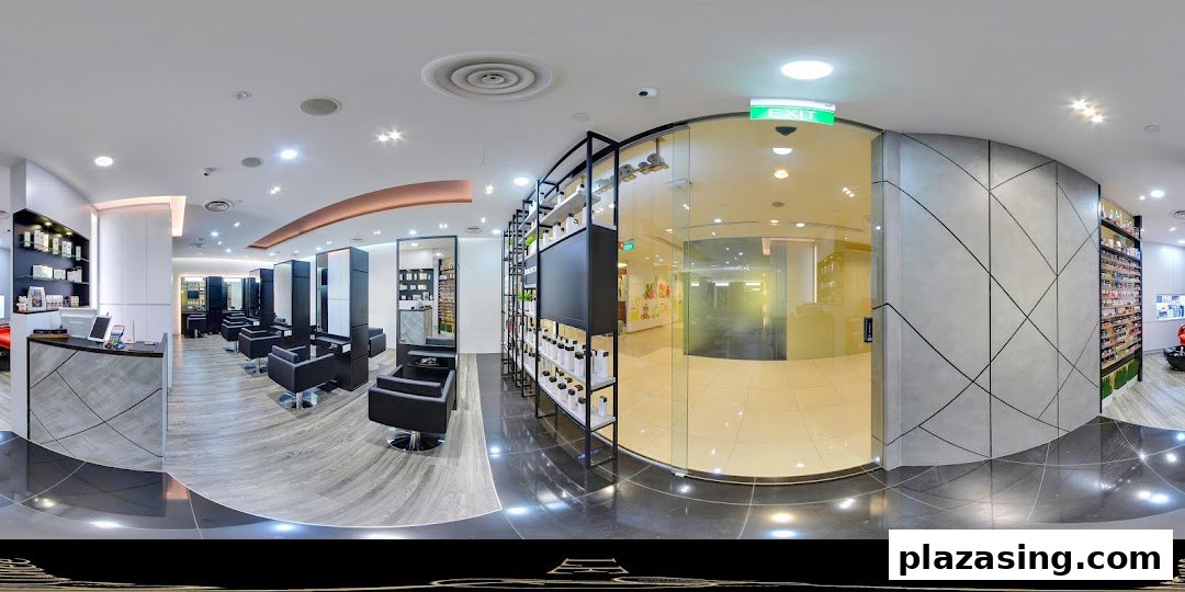 A modern hair salon interior with styling chairs, product displays, and a reception area.