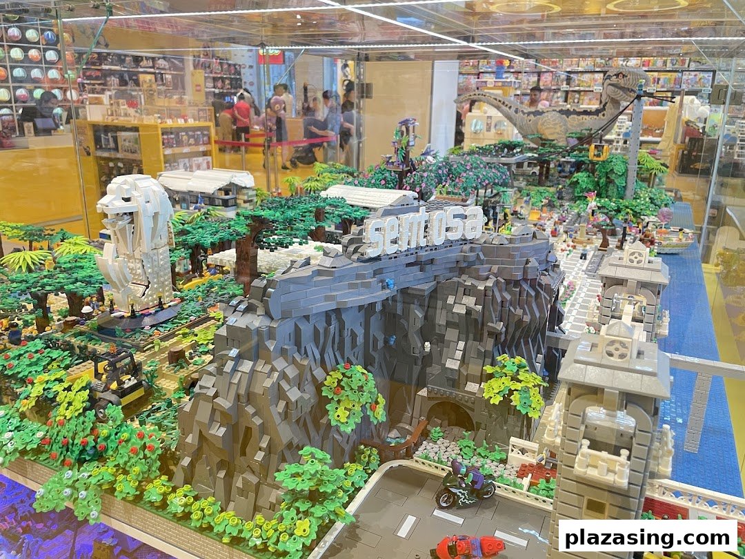 An intricate LEGO diorama of Sentosa Island featuring the Merlion, a dinosaur, and detailed landscapes.