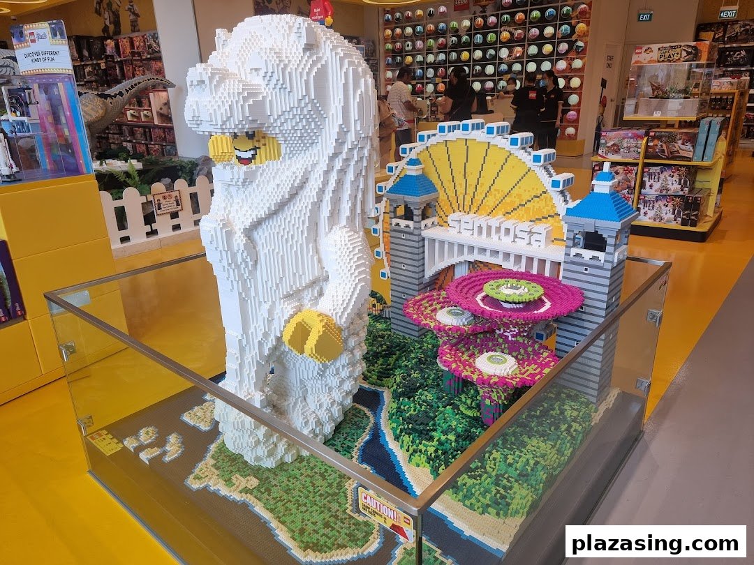 Large LEGO models of Singapore landmarks, including the Merlion and a bridge, displayed inside the store.