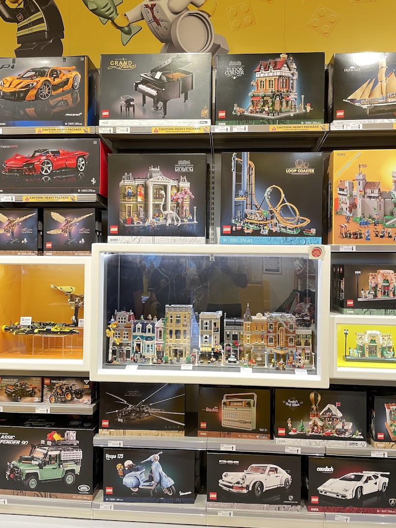 A vibrant display of diverse LEGO sets, including iconic vehicles, modular buildings, and intricate models.