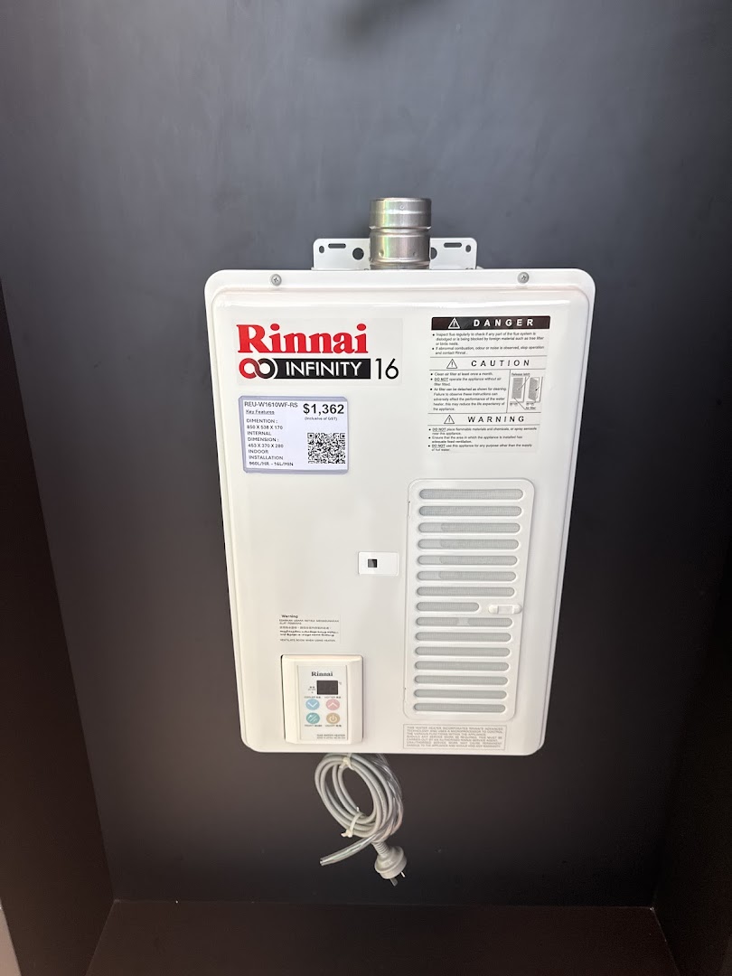 A Rinnai Infinity 16 water heater displayed on a dark wall.