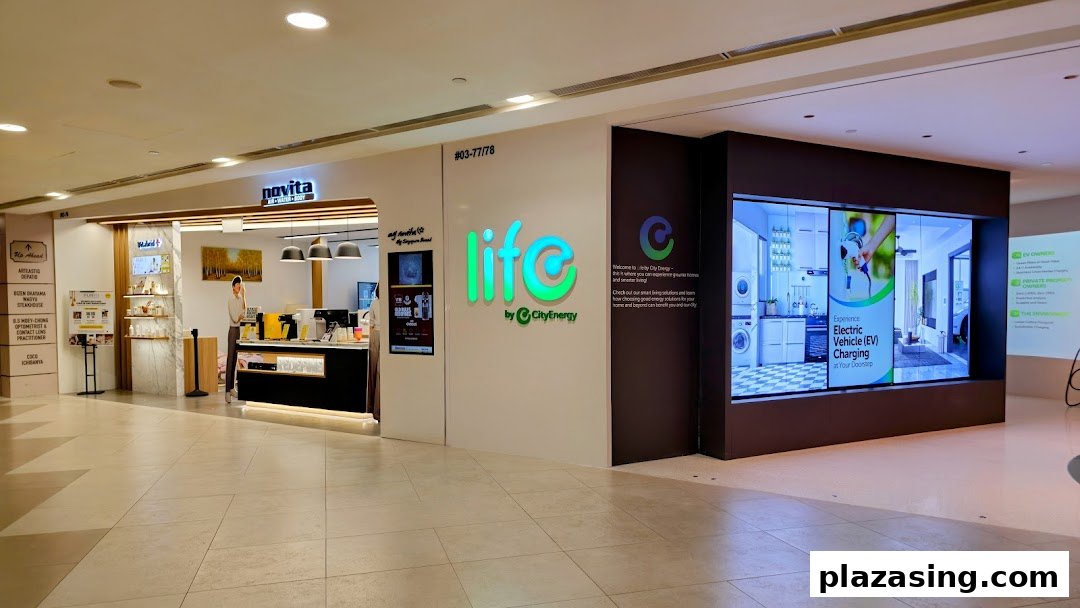 The shop front of 'Life by City Energy' featuring its logo, digital displays, and an adjacent Novita store.