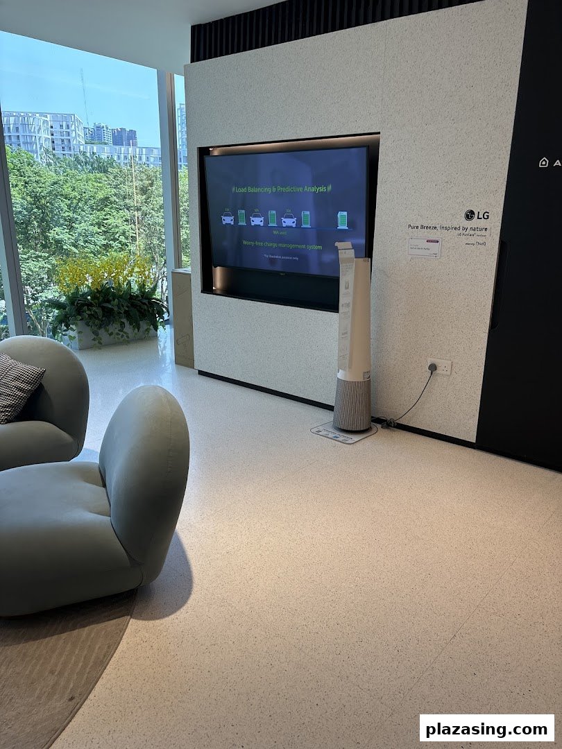 A modern retail interior featuring an LG display on energy solutions, comfortable seating, and a scenic view.