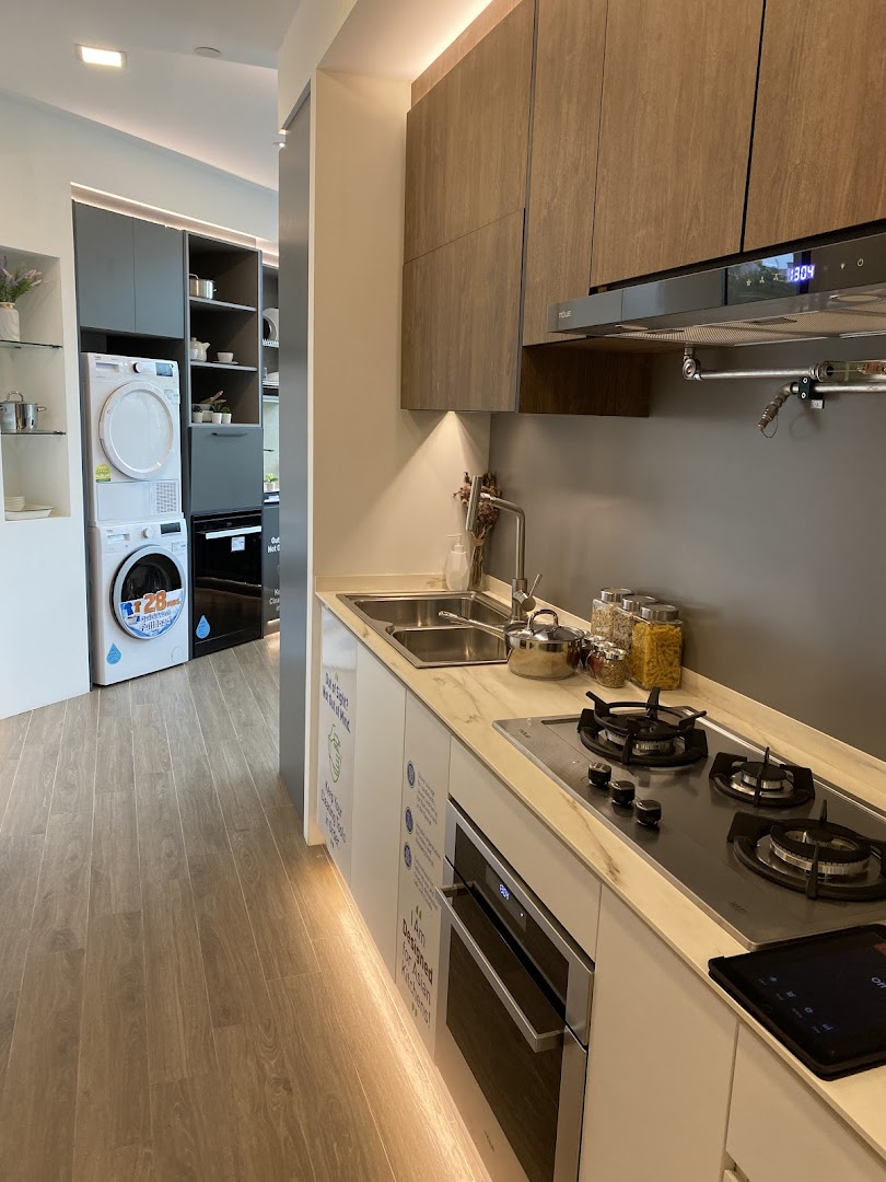 A modern kitchen and laundry appliance display showcasing integrated home solutions.