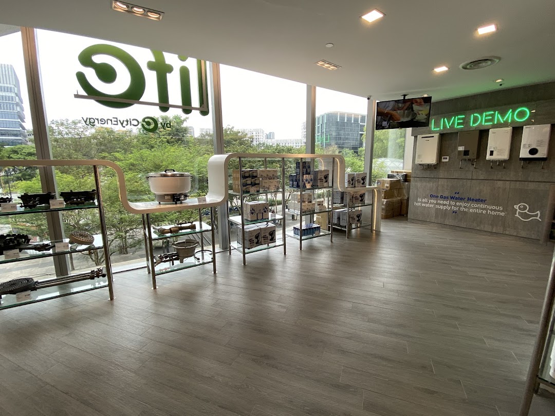 Interior view of Life by City Energy, showcasing home appliances and a gas water heater demo area.