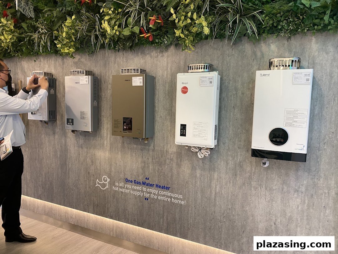 A display of various gas water heaters on a wall, with a person taking a photo.