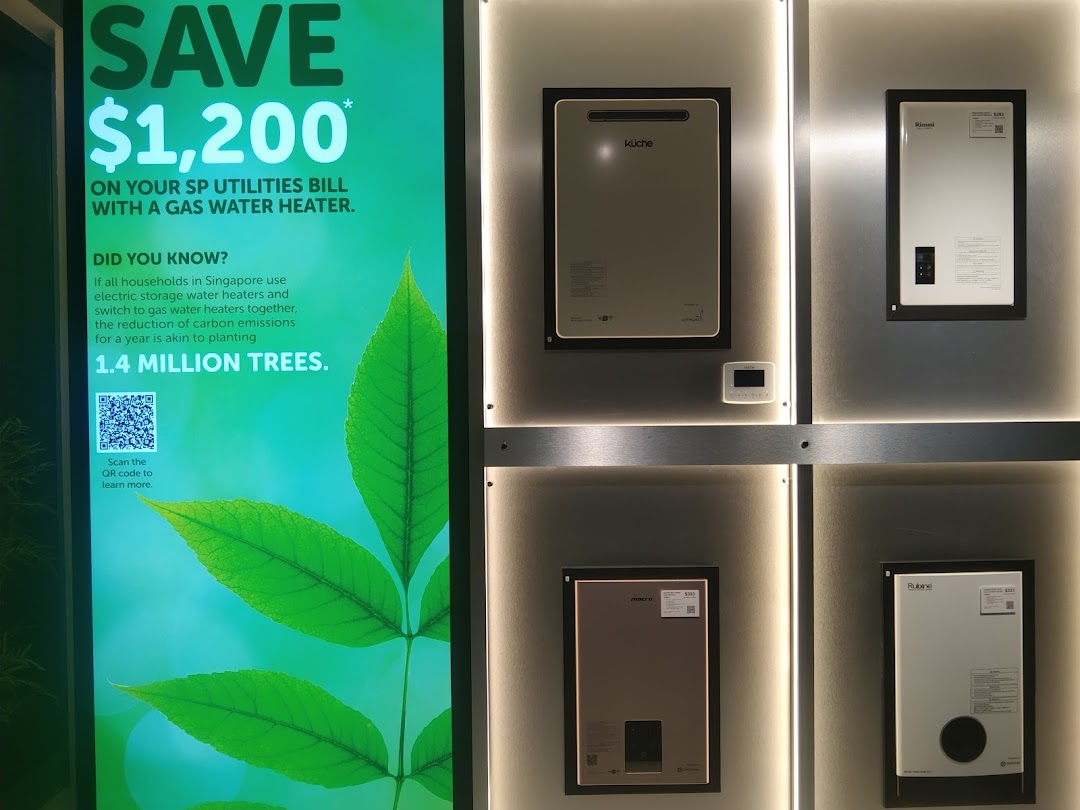 An interior display showcasing gas water heaters and a promotional sign about energy savings.