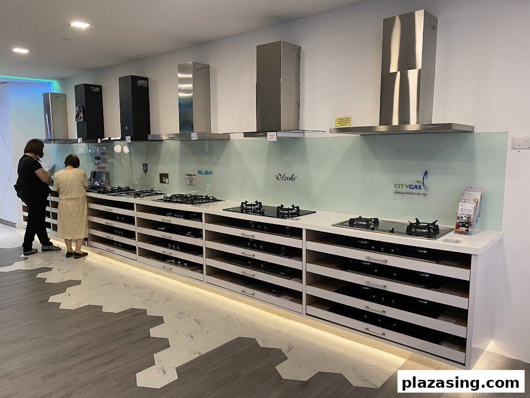 Two customers browse a display of modern kitchen gas stoves and range hoods at Life by City Energy.
