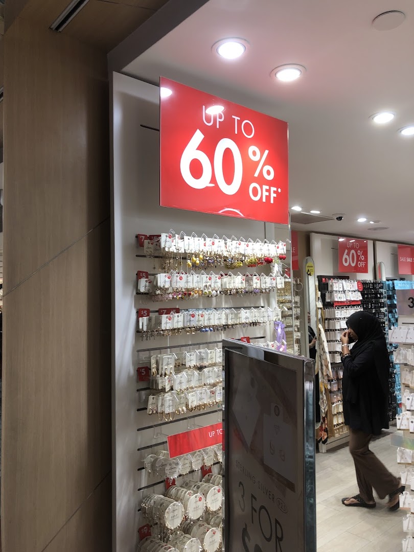 Interior view of Lovisa showcasing jewelry displays and a prominent 'Up to 60% Off' sale sign.