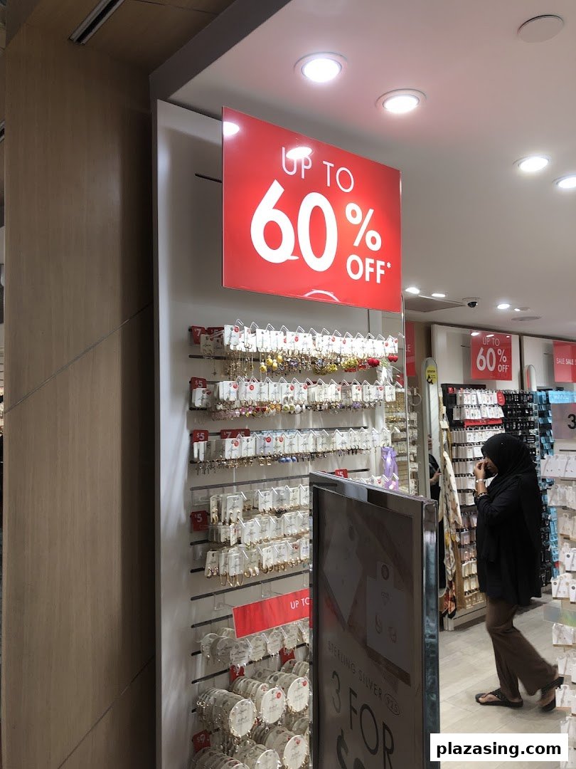 Interior view of Lovisa showcasing jewelry displays and a prominent 'Up to 60% Off' sale sign.