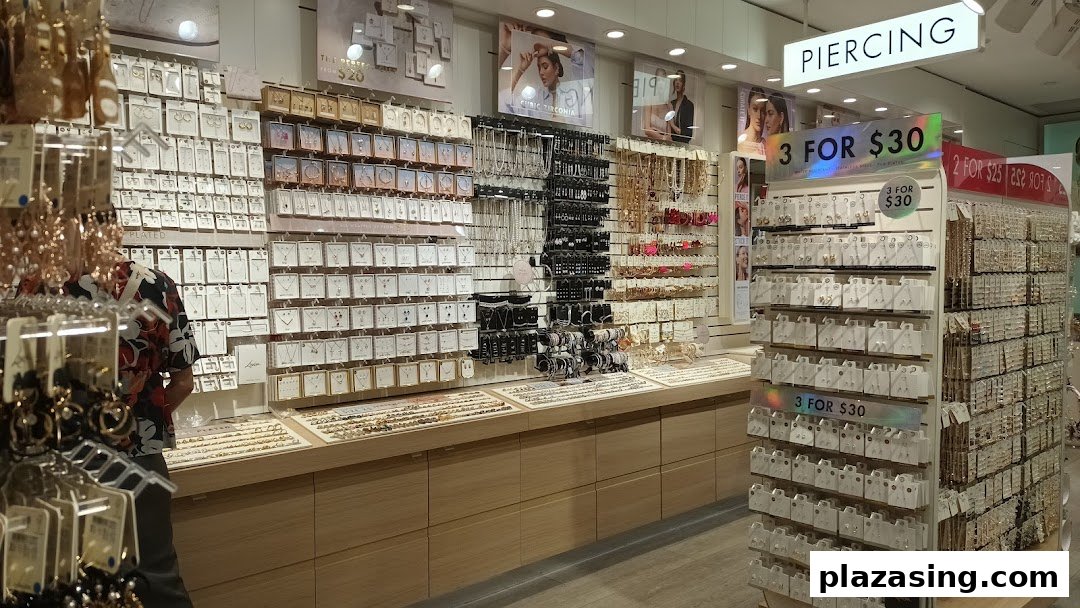 Interior view of a Lovisa store showcasing extensive displays of earrings, necklaces, and other fashion jewelry.