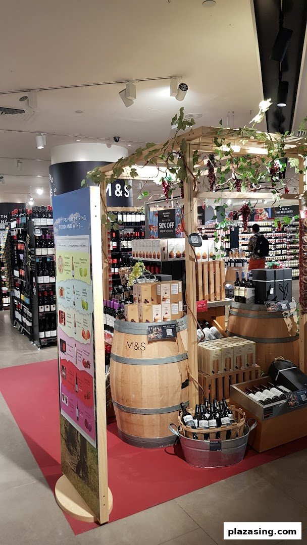 An in-store display at Marks & Spencer featuring wine, food pairings, and related products.
