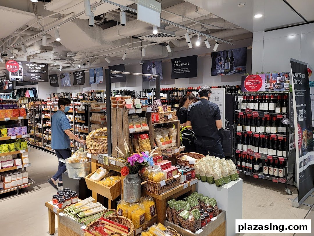 An interior view of Marks & Spencer's food hall, showcasing a wide selection of wines, groceries, and gourmet products.