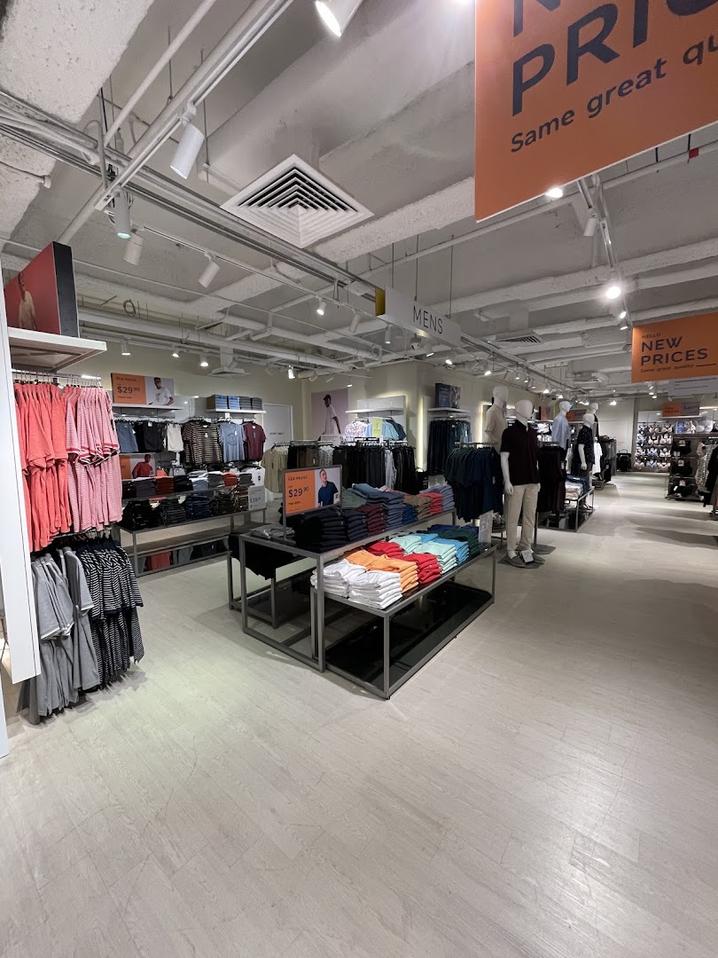 An interior view of the men's clothing section at Marks & Spencer, featuring neatly displayed apparel and mannequins.