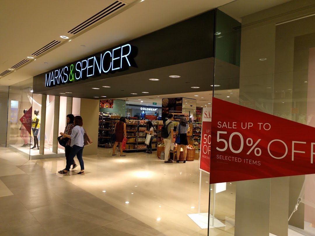 The Marks & Spencer shop entrance with a prominent 'Sale up to 50% Off' sign visible.
