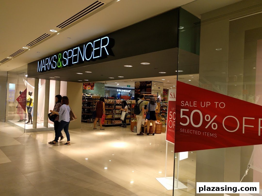 The Marks & Spencer shop entrance with a prominent 'Sale up to 50% Off' sign visible.