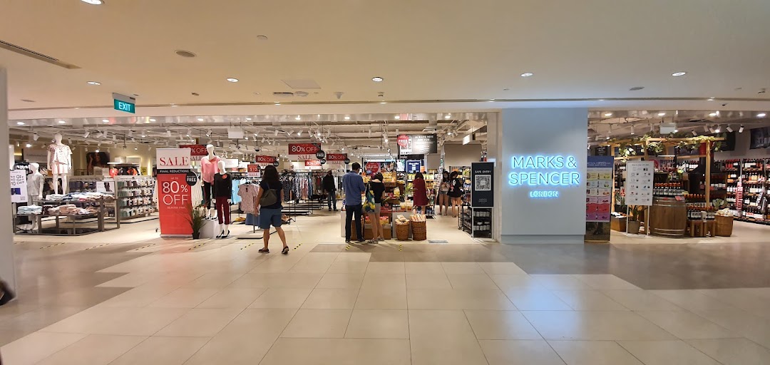 Interior view of Marks & Spencer, showcasing clothing, food sections, and ongoing sales.