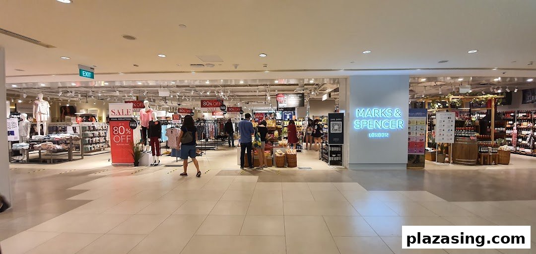 Interior view of Marks & Spencer, showcasing clothing, food sections, and ongoing sales.