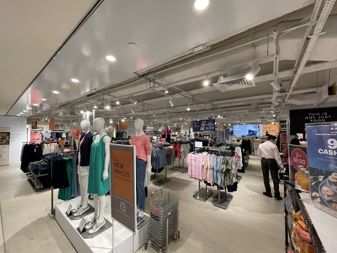 Interior view of Marks & Spencer showcasing clothing displays, mannequins, and shopping aisles.