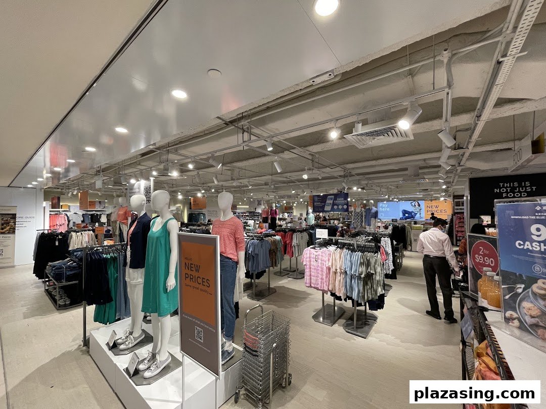 Interior view of Marks & Spencer showcasing clothing displays, mannequins, and shopping aisles.