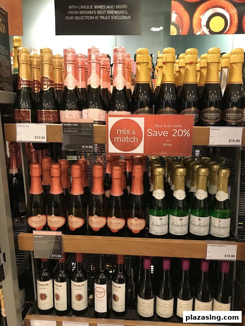 Shelves displaying various sparkling wine and wine bottles with prices and a 'mix & match' offer.