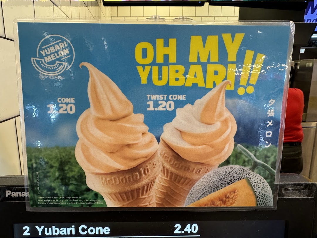A promotional poster for McDonald's Yubari Melon ice cream, showing cone and twist cone options with prices.