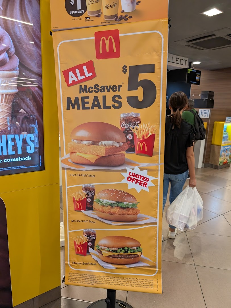 A McDonald's promotional banner showcasing $5 McSaver Meals, including Filet-O-Fish, McChicken, and Smoky Beef options.