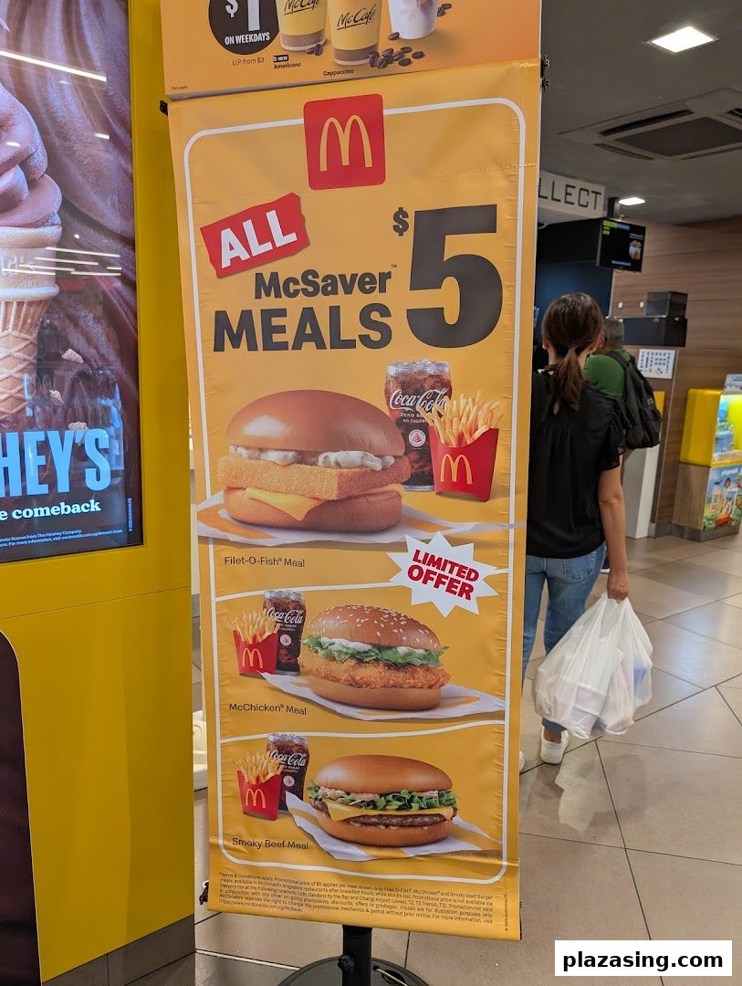 A McDonald's promotional banner showcasing $5 McSaver Meals, including Filet-O-Fish, McChicken, and Smoky Beef options.