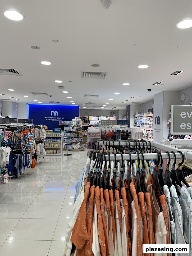 An interior view of Mothercare, showcasing racks of baby and children's clothing and essentials.