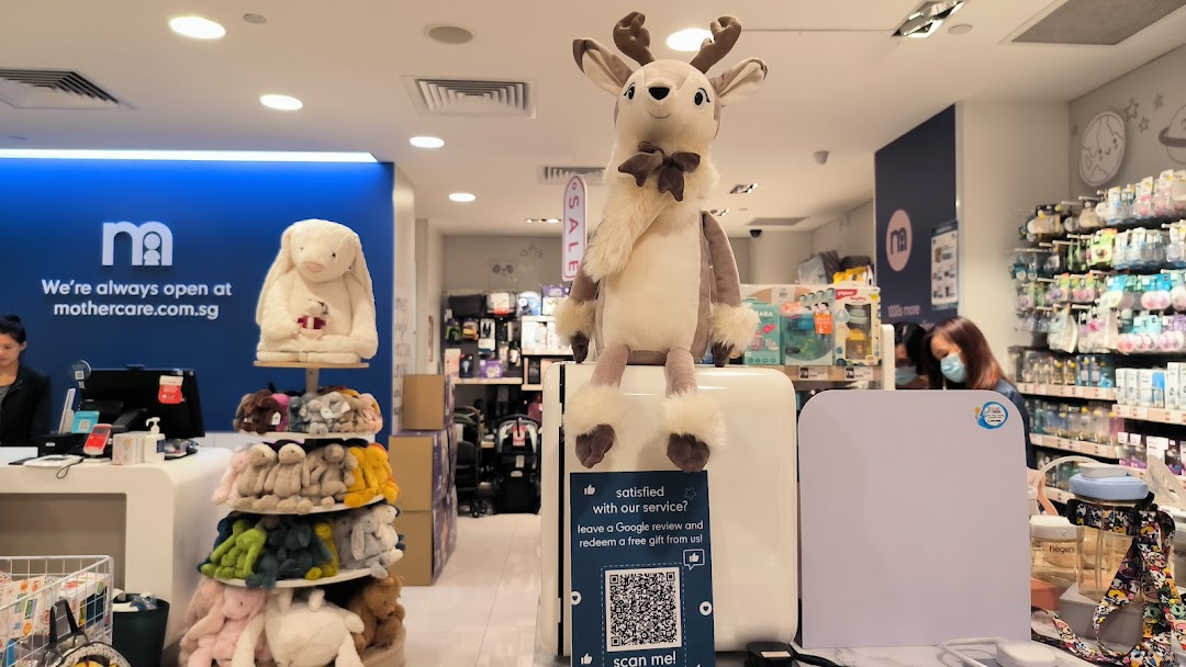 Interior view of Mothercare, showcasing baby products, plush toys, and a welcoming atmosphere.