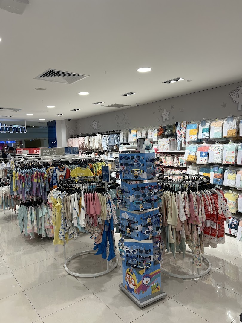 An interior view of Mothercare, showcasing a wide array of baby and children's clothing and accessories.