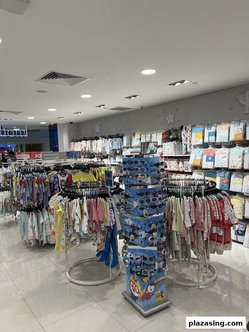 An interior view of Mothercare, showcasing a wide array of baby and children's clothing and accessories.