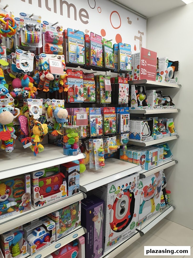 A vibrant display of baby toys, educational items, and accessories on shelves inside Mothercare.