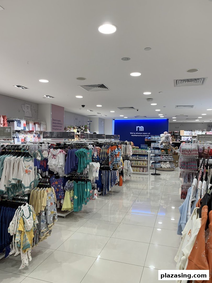 Interior view of Mothercare, showcasing racks of baby and children's clothing and essential products.