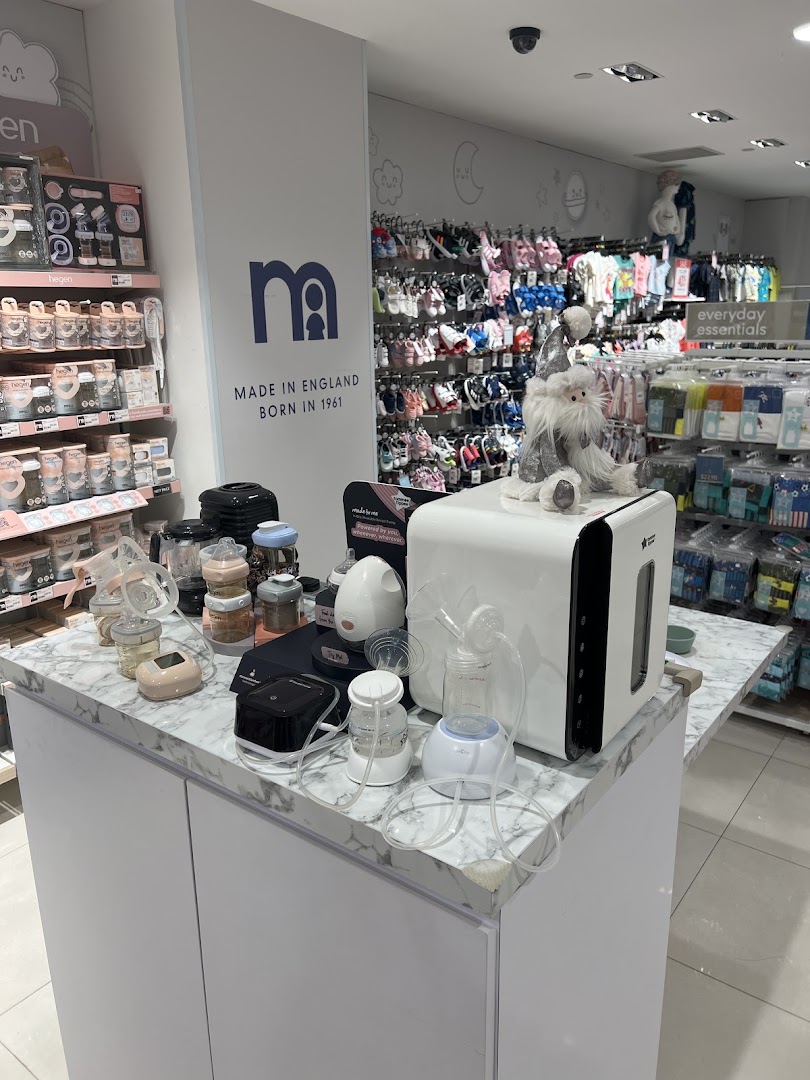 Interior view of Mothercare showcasing baby essentials, feeding products, and clothing displays.