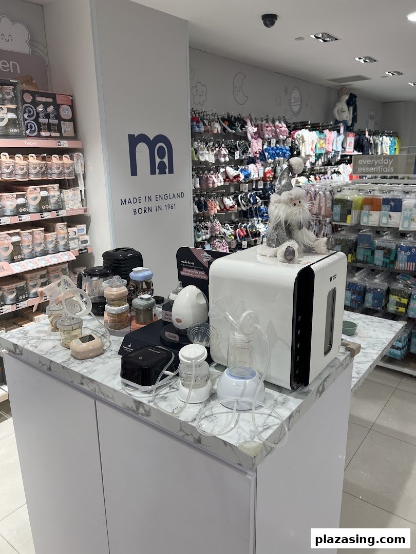 Interior view of Mothercare showcasing baby essentials, feeding products, and clothing displays.